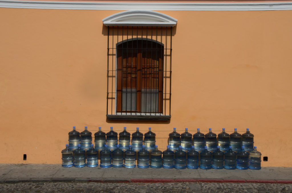 window with water jugs