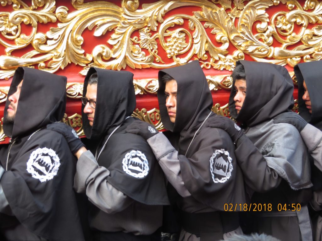 men lined up with hoodies