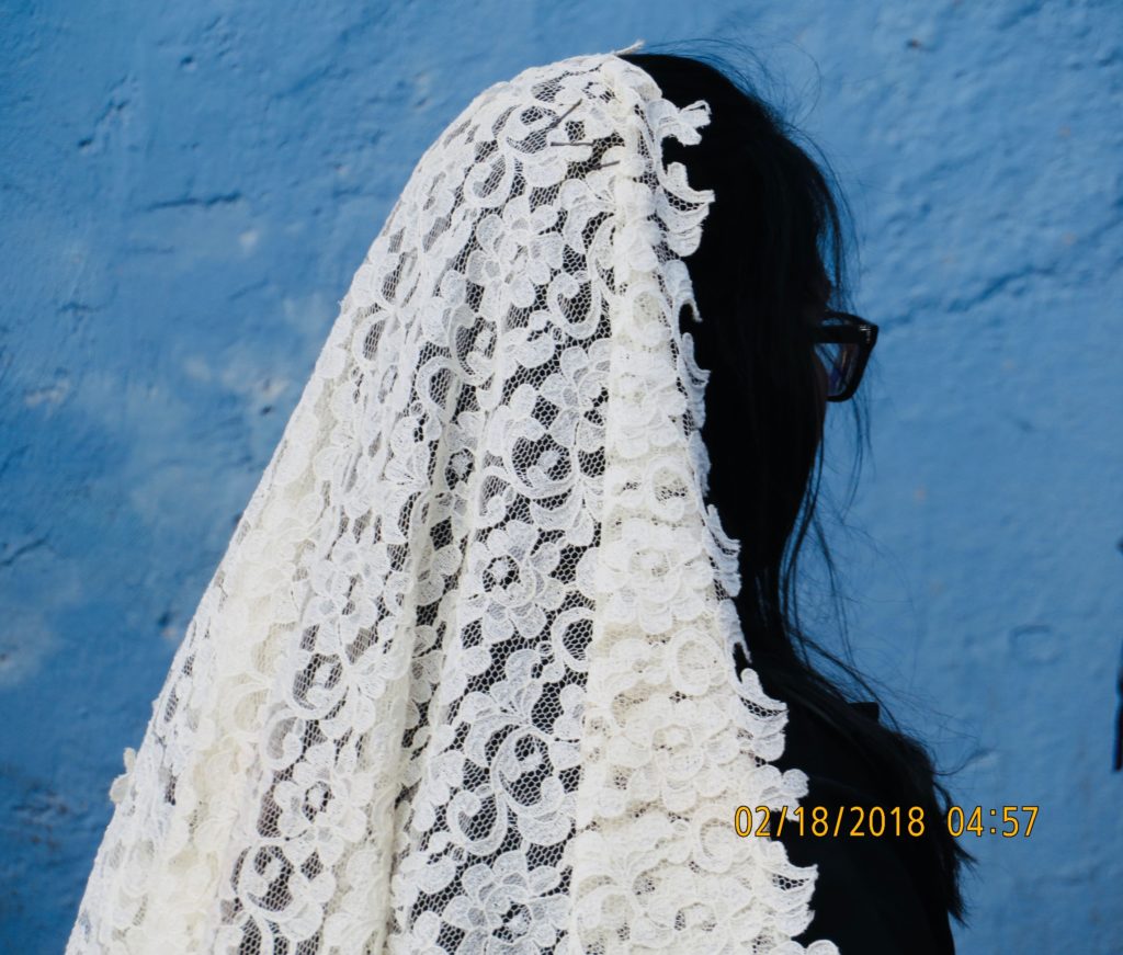 lady wearing white with blue background