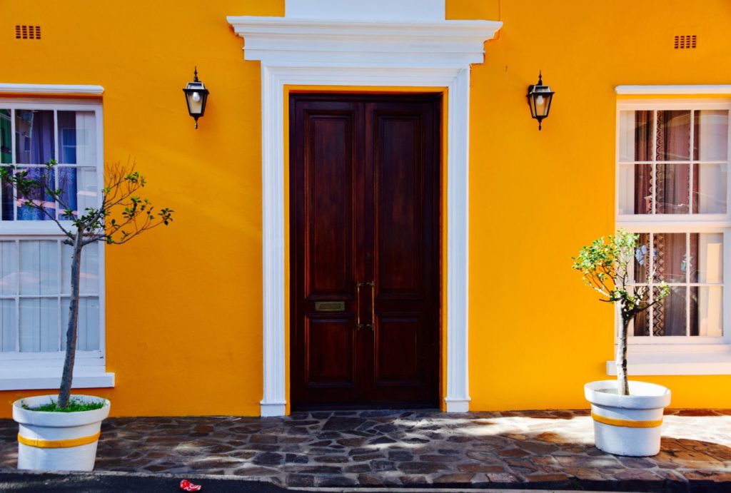 orange building with wooden door